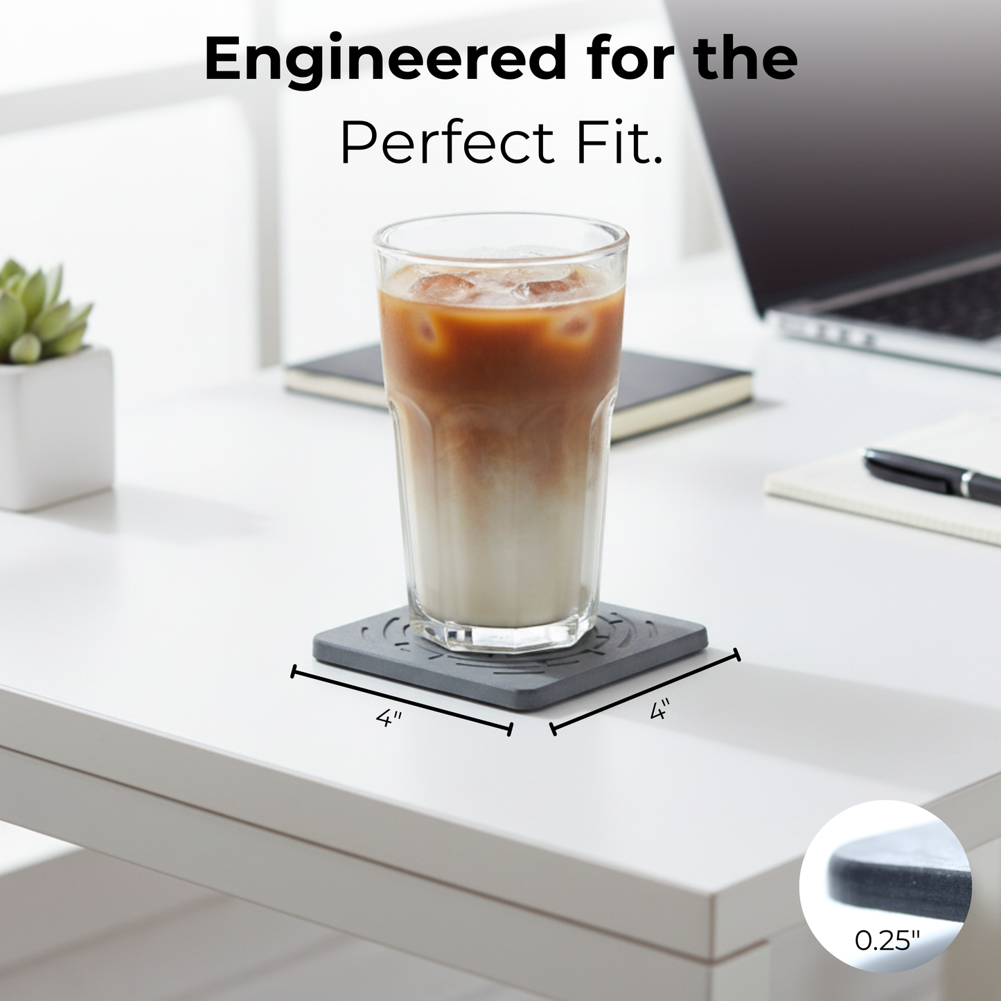 Glass of iced coffee on a coaster with text 'Engineered for the Perfect Fit' and measurements. Modern, minimalist stone coasters protecting a office tabletop.

