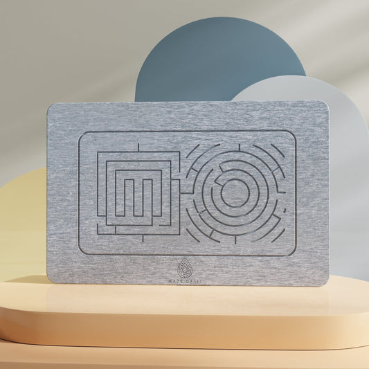 A rectangular stone bath mat with a maze pattern, displayed against a neutral background.